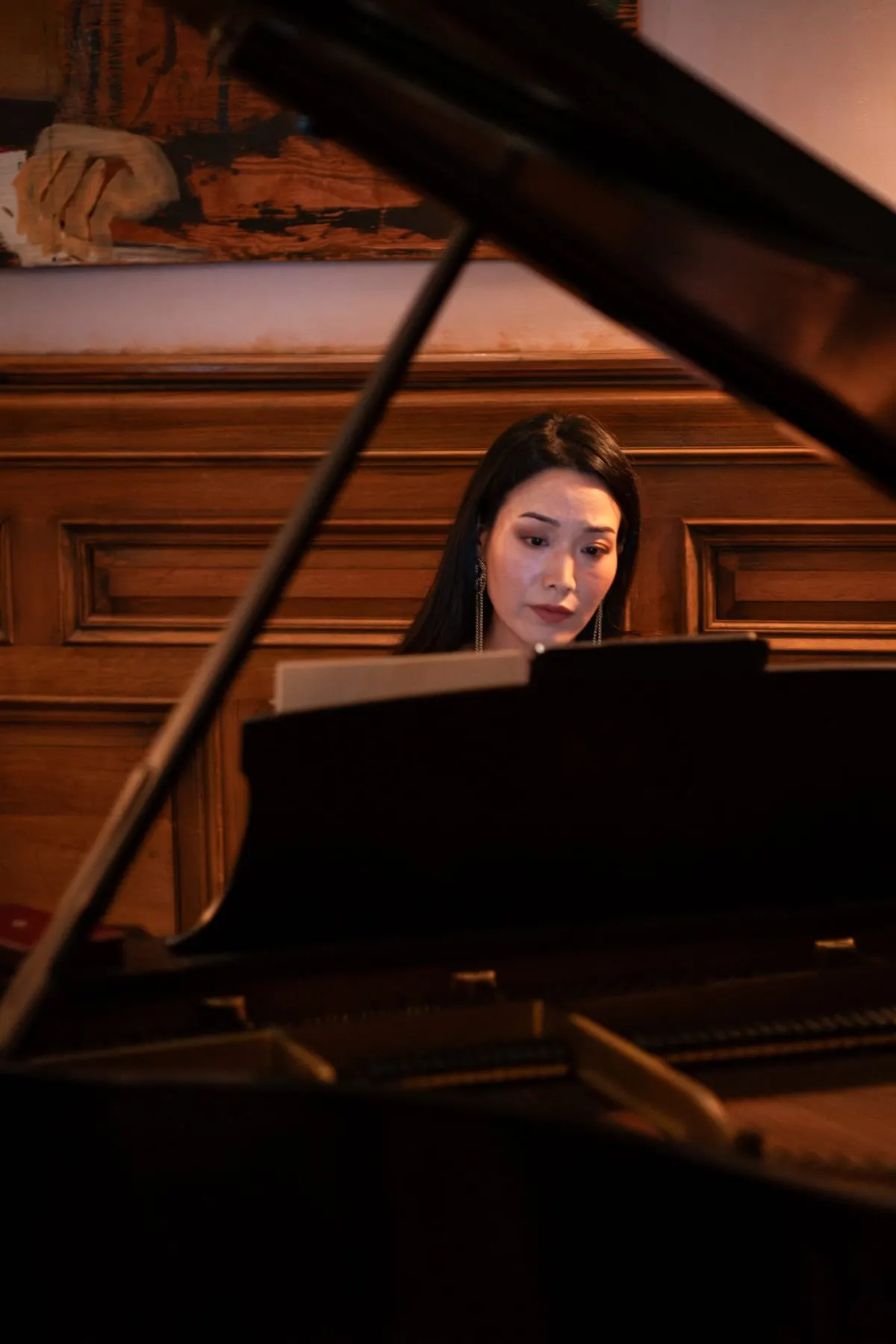 Rieko at the piano, past the open lid