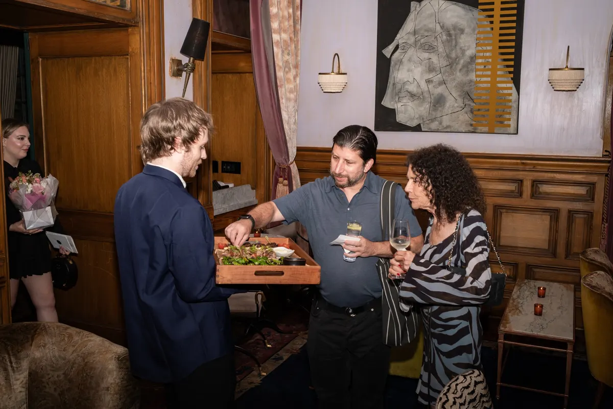Guests helping themselves from a tray of Teruko bites