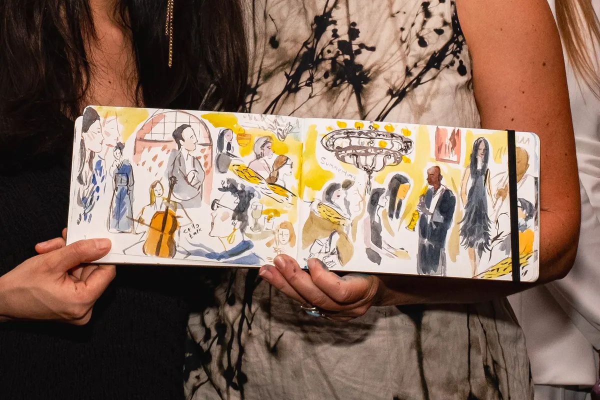 A guest’s painted sketchbook of the evening