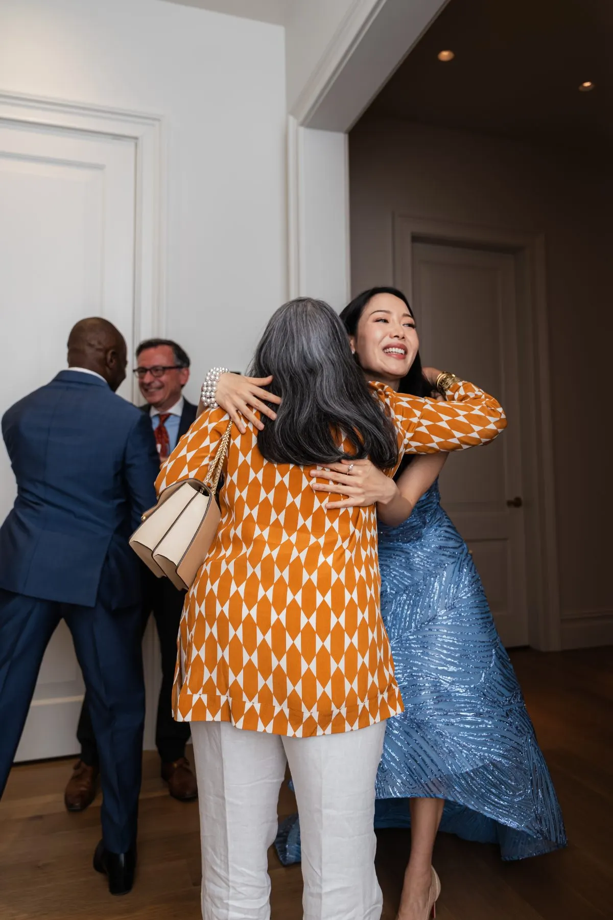 Guests greeting each other in the townhouse hall