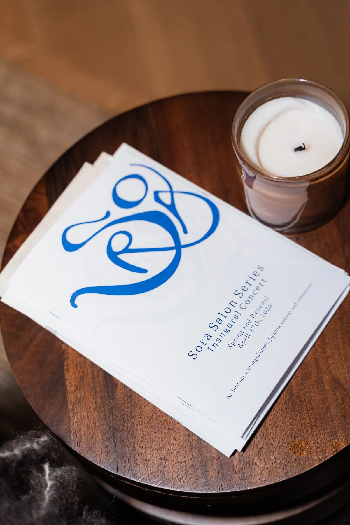 A candle beside the evening program